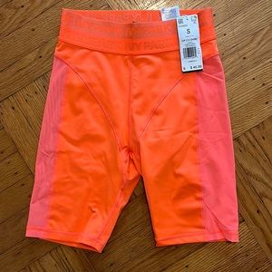 Ivy park orange bike shorts. Sheer panels